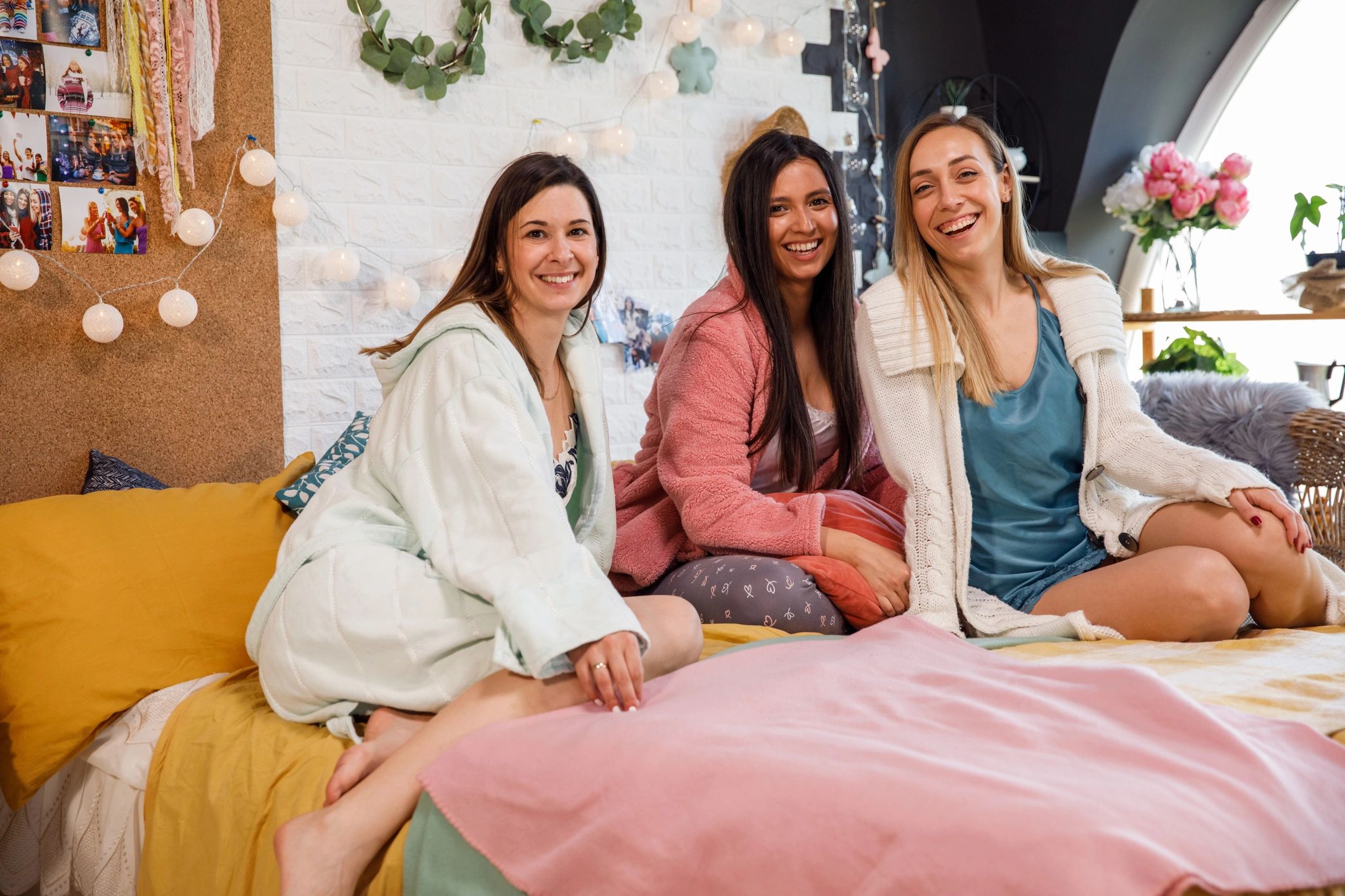Friends in pajamas enjoying a stylish party activity together