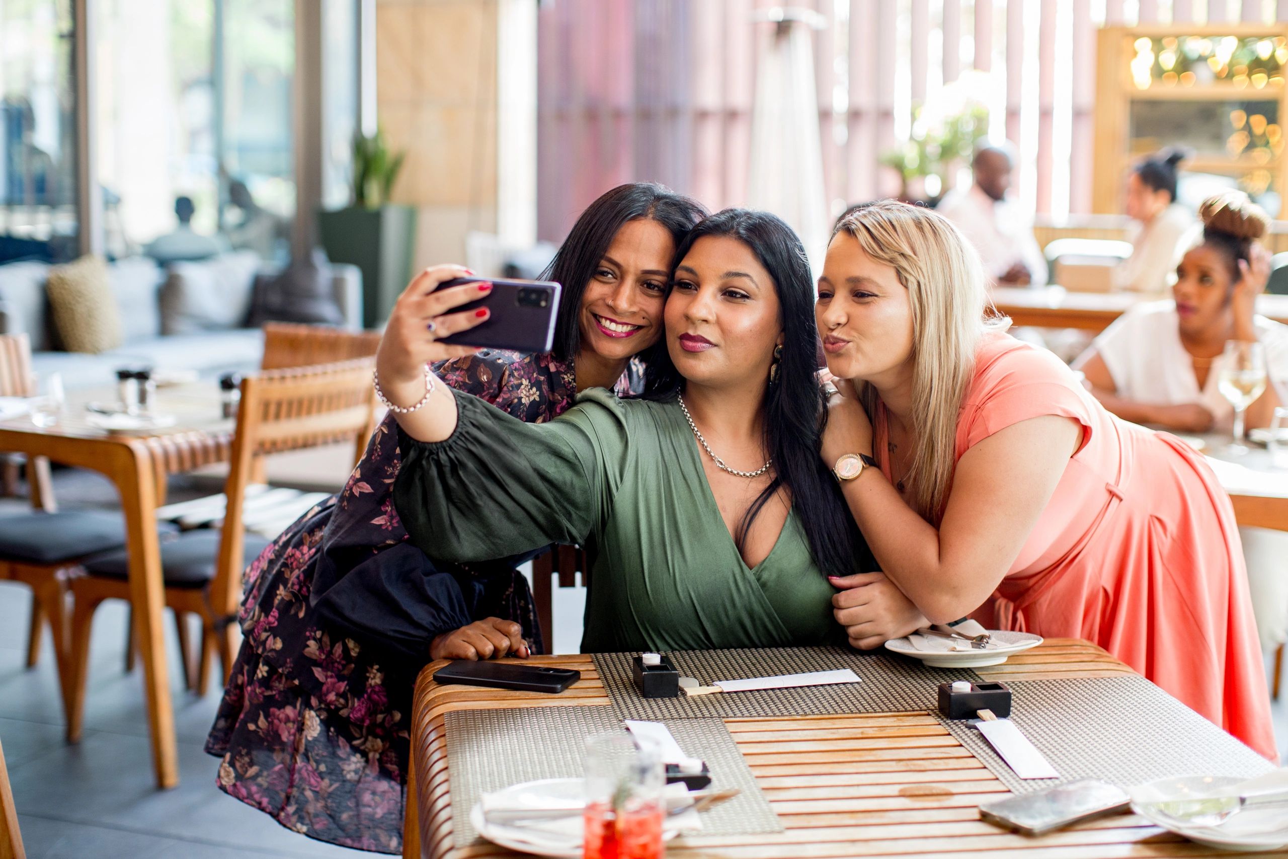 Women celebrating together at a stylish beauty event